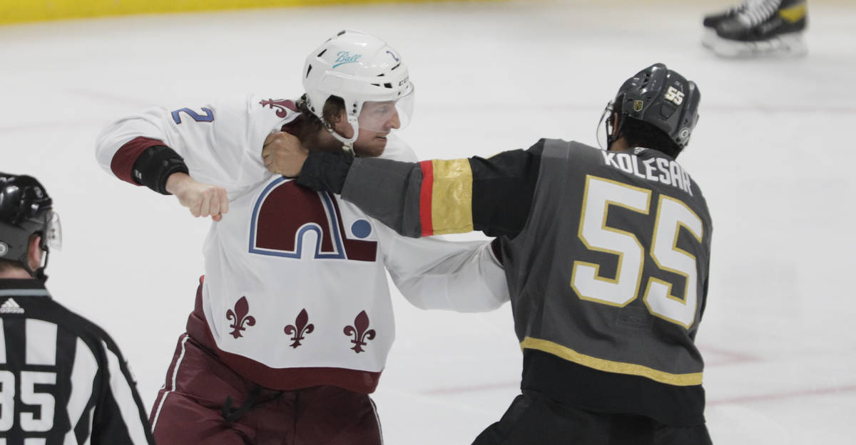 Vegas Golden Knights right wing Alex Tuch (89) hugs left wing Max Pacioretty (67) as defenseman ...