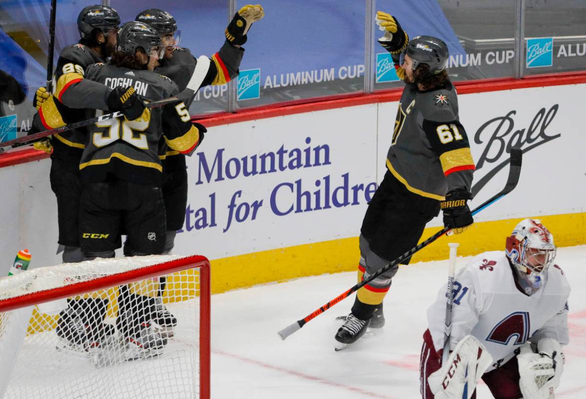 Vegas Golden Knights right wing Alex Tuch (89) and defenseman Dylan Coghlan (52) hug Golden Kni ...