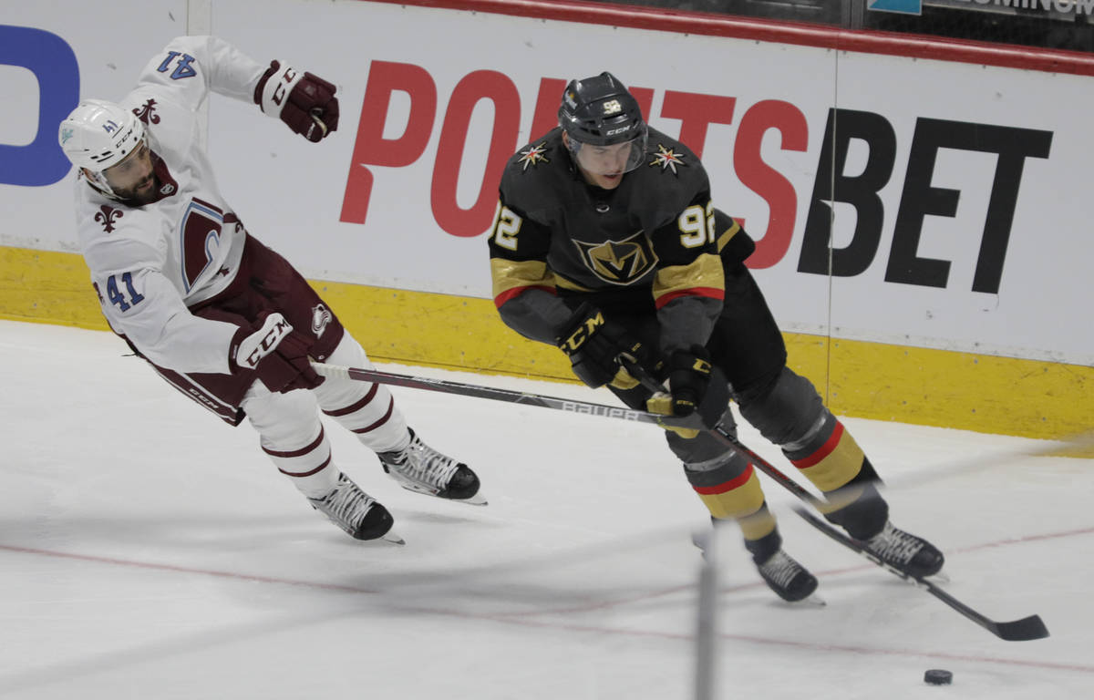 Colorado Avalanche center Pierre-Edouard Bellemare (41) stick checks Vegas Golden Knights left ...