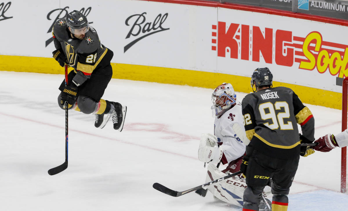 Vegas Golden Knights left wing William Carrier (28) hops over a shot against Colorado Avalanche ...