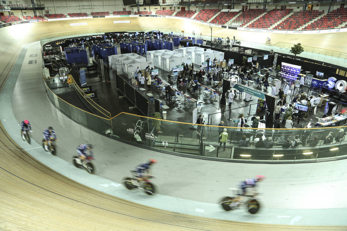 Riders train at the National Velodrome at Saint-Quentin-en-Yvelines, west of Paris, Saturday, M ...