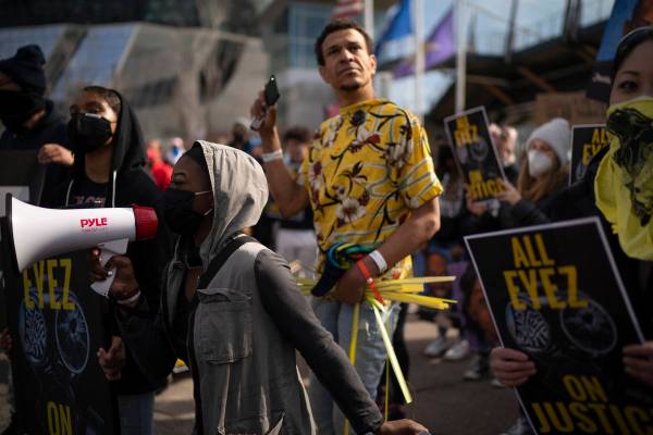 Marchers chant outside US Bank Stadium in Minneapolis Sunday, March 28, 2021, on the eve of the ...