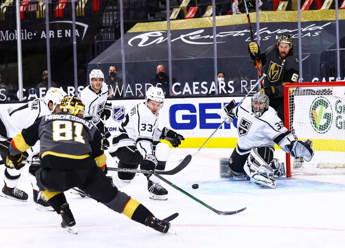 Los Angeles Kings goaltender Jonathan Quick (32) looks to block a shot from Golden Knights' Jon ...