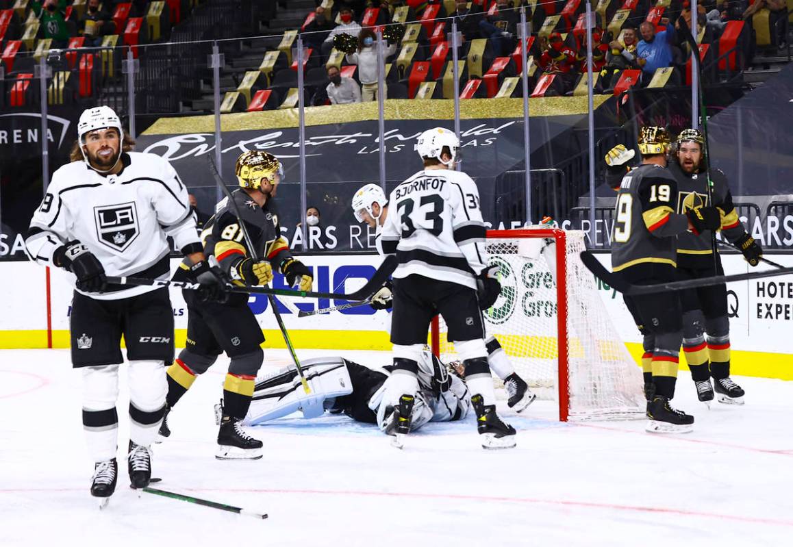 Golden Knights' Reilly Smith (19) celebrates his goal with Mark Stone, right, during the second ...