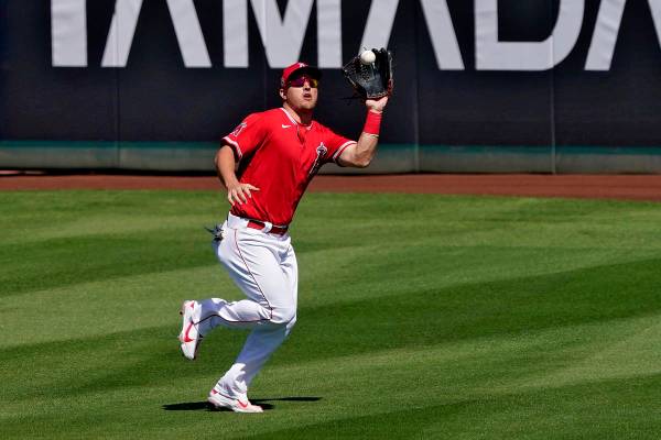 Los Angeles Angels' Mike Trout fields a fly-out hit by Chicago Cubs' Matt Duffy during the seco ...