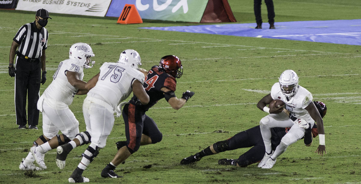 UNLV’s Justin Rogers is sacked by San Diego State’s Connor Mitchell during Saturd ...