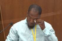In this image from video, witness Donald Williams wipes his eyes as he answers questions, as He ...