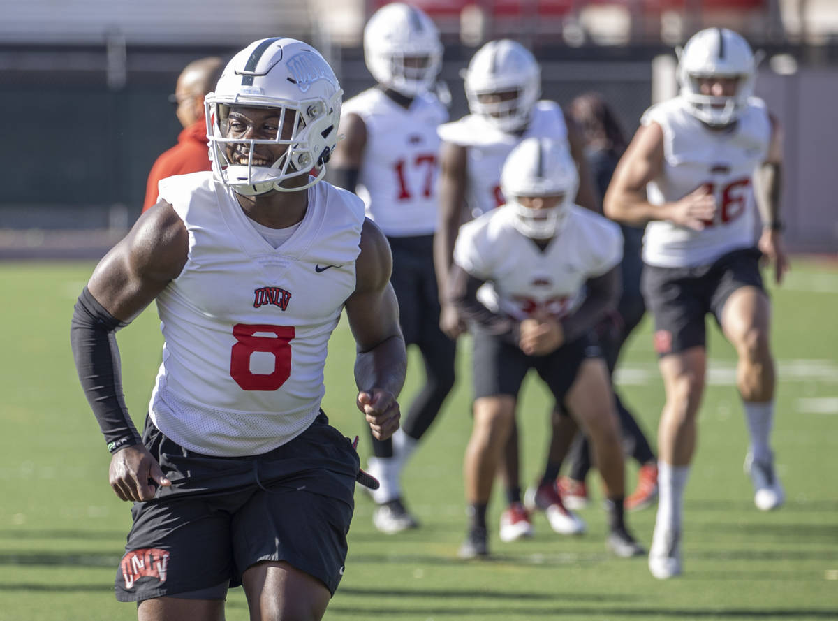 UNLV running back Charles Williams (8) warms up during the first spring football practice at Re ...