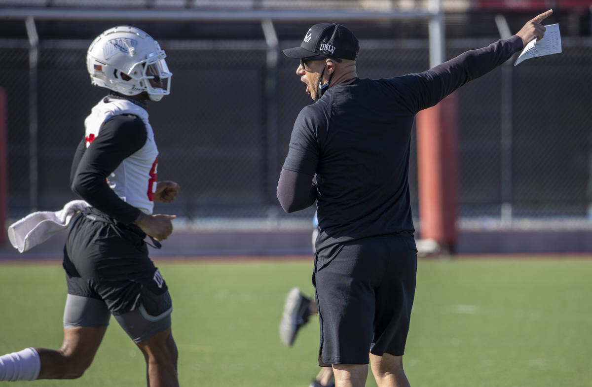 UNLV head coach Marcus Arroyo yells instructions during the first spring football practice at R ...
