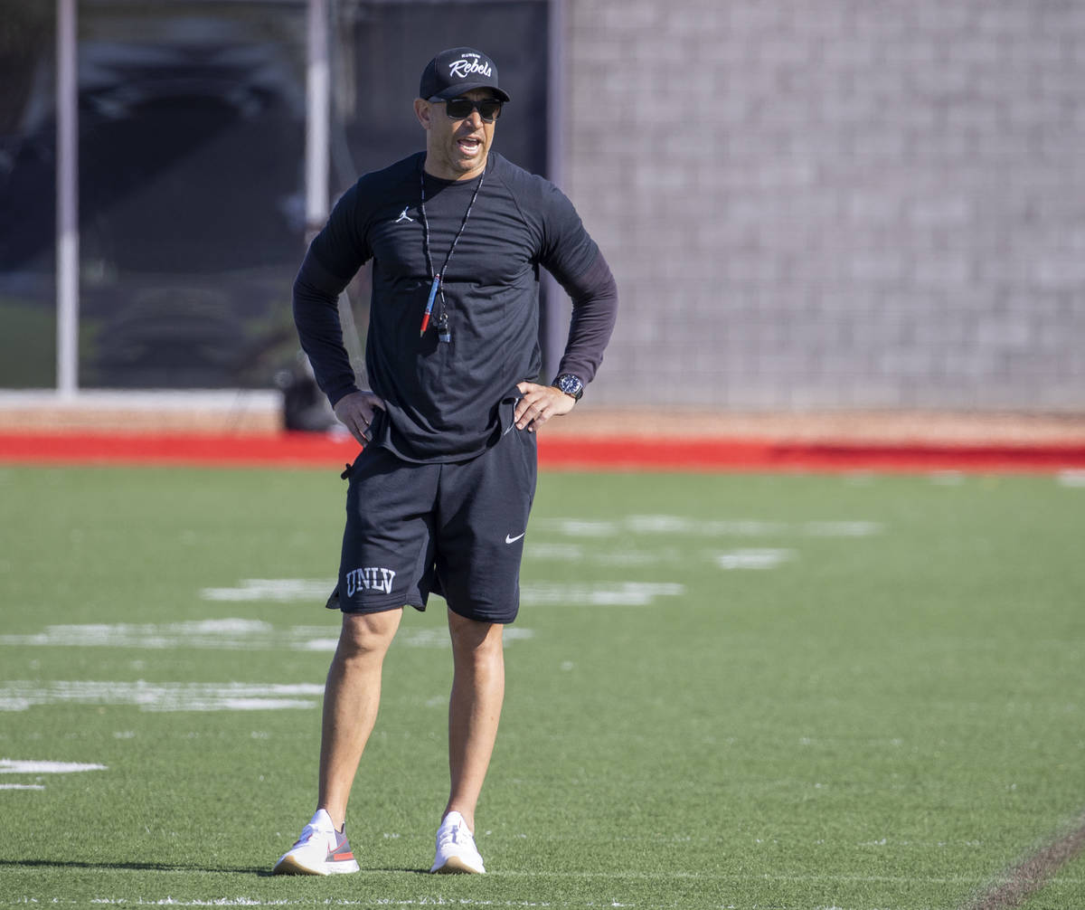 UNLV head coach Marcus Arroyo yells instructions during the first spring football practice at R ...