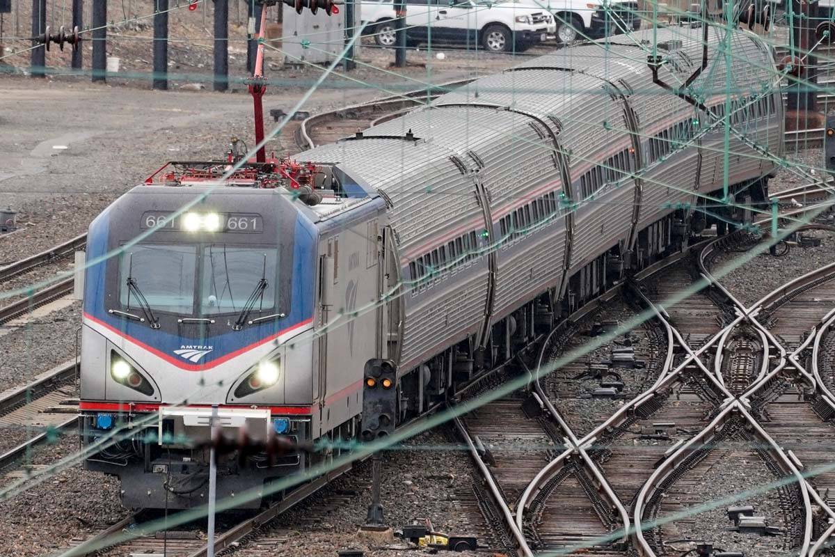 An Amtrak train departs 30th Street Station in Philadelphia, Wednesday, March 31, 2021. (AP Pho ...