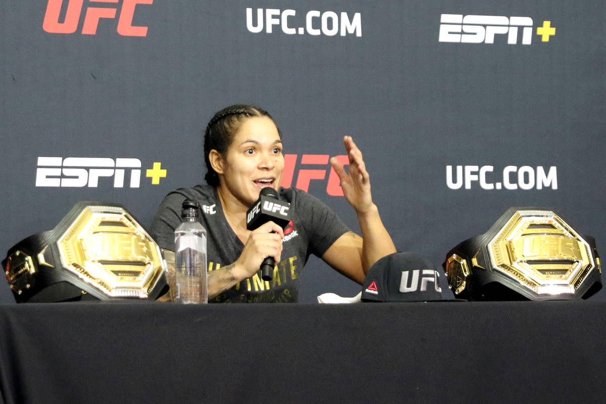 UFC women's bantamweight and featherweight champion Amanda Nunes speaks during a post-fight new ...