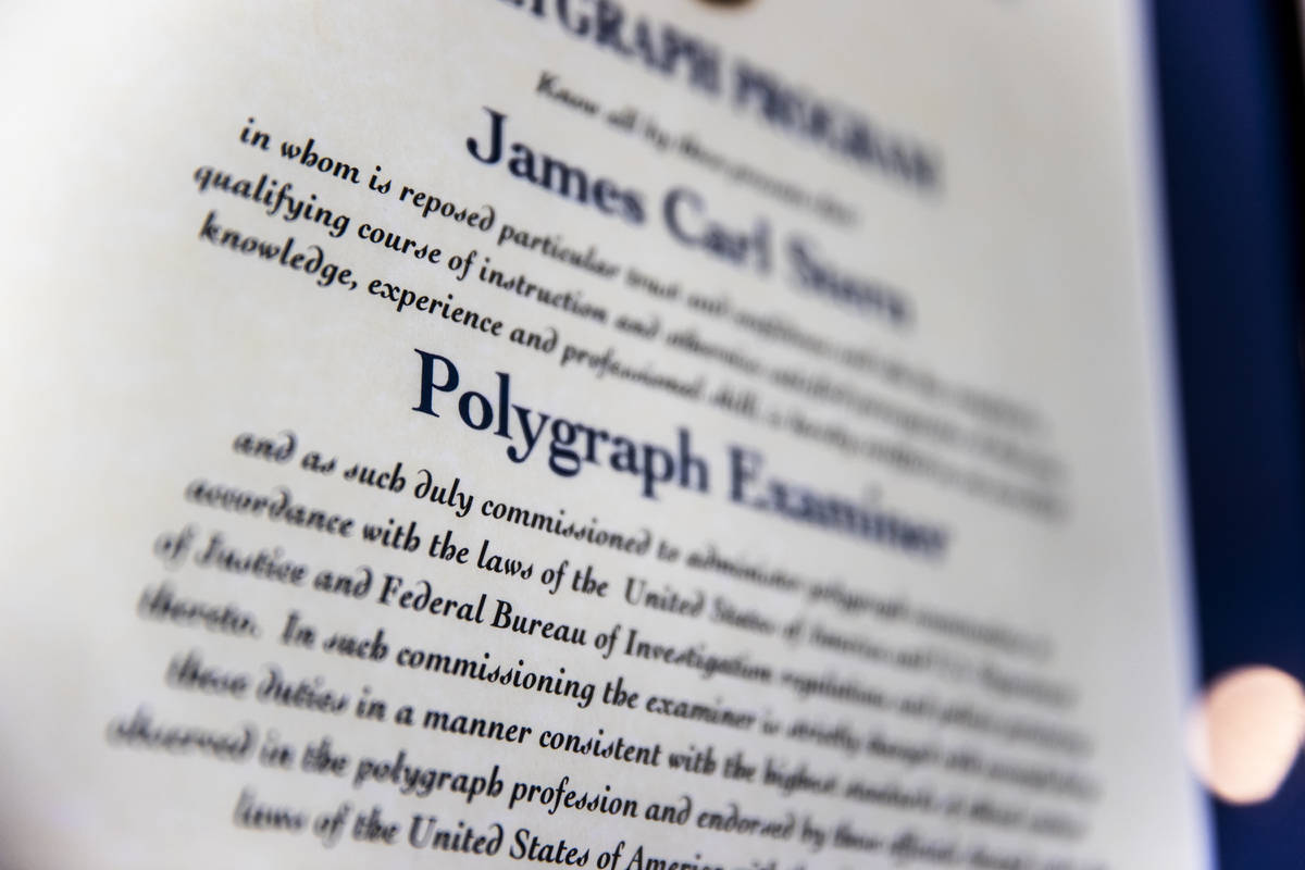 Retired FBI agent Jim SternÕs framed polygraph examiners certification at his home in Las ...