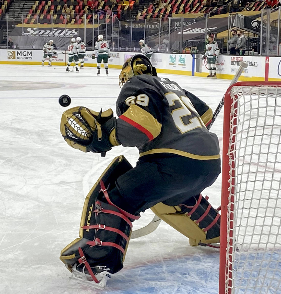 Golden Knights goaltender Marc-Andre Fleury (29) deflects a shot during.warm ups prior to the ...