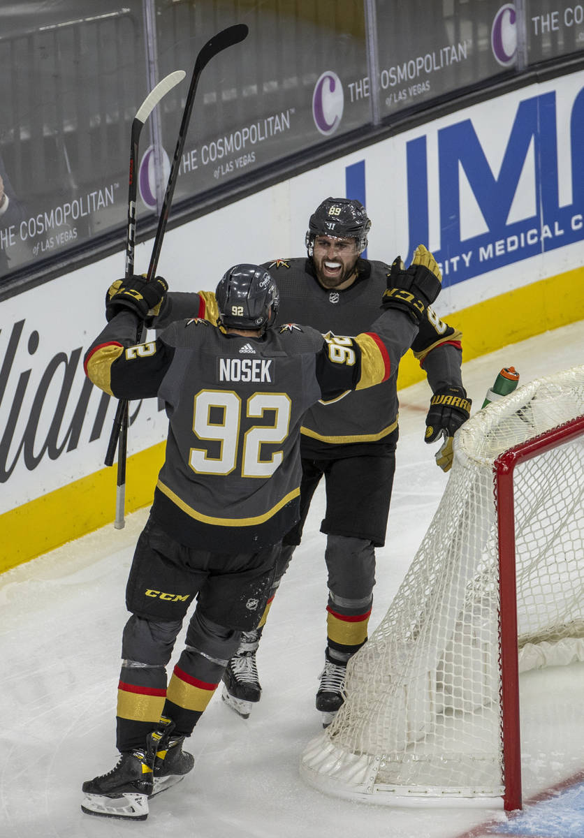 Golden Knights right wing Alex Tuch (89) and left wing Tomas Nosek (92) celebrate a goal during ...