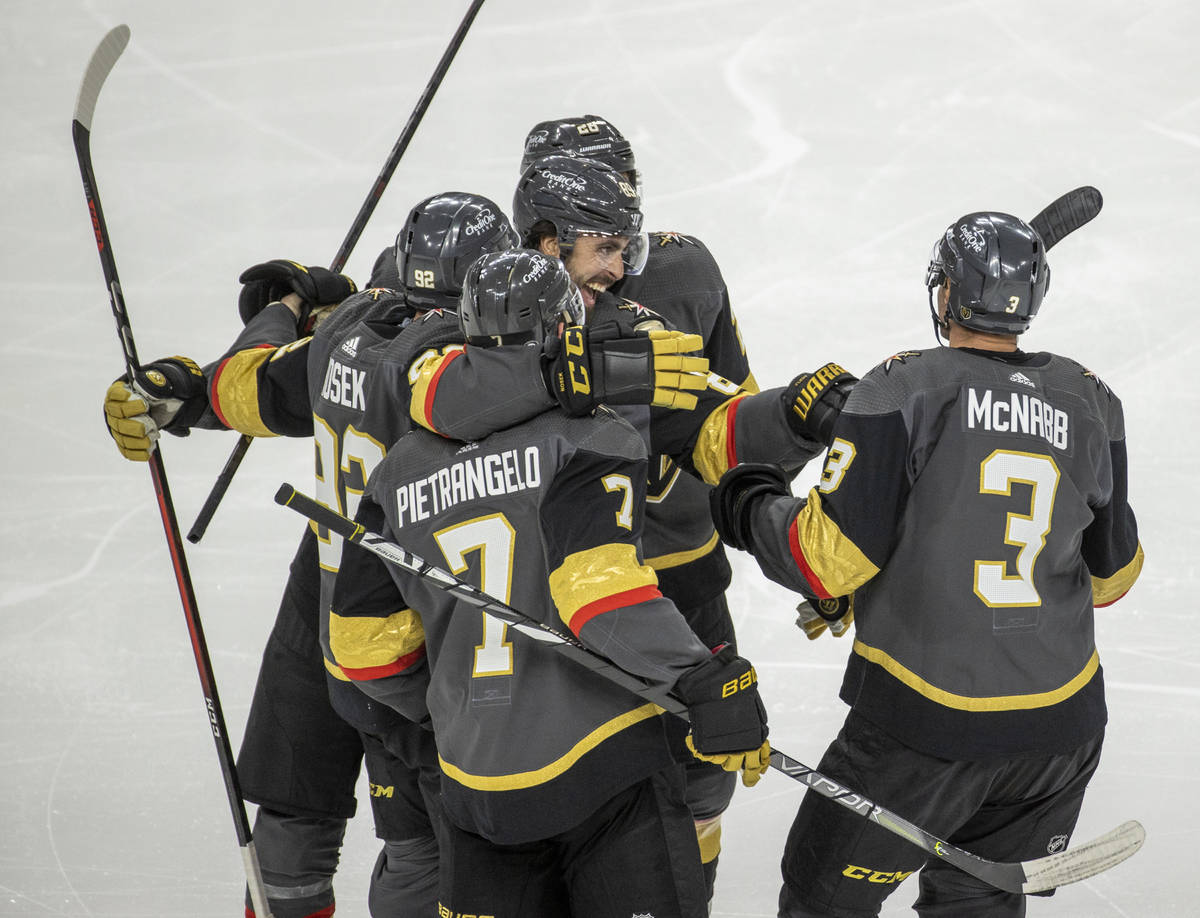 Golden Knights players celebrate a goal over the Minnesota Wild during the third period of an N ...