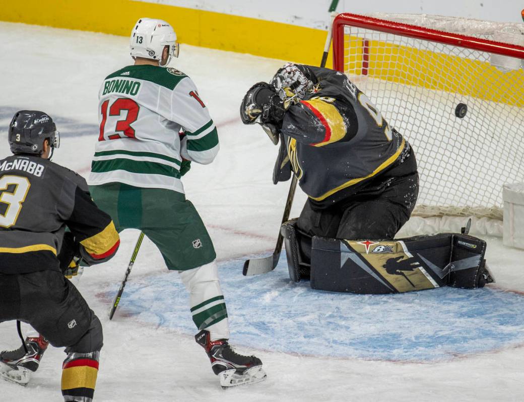 Minnesota Wild center Nick Bonino (13) gets off a close deflection past Golden Knights goaltend ...