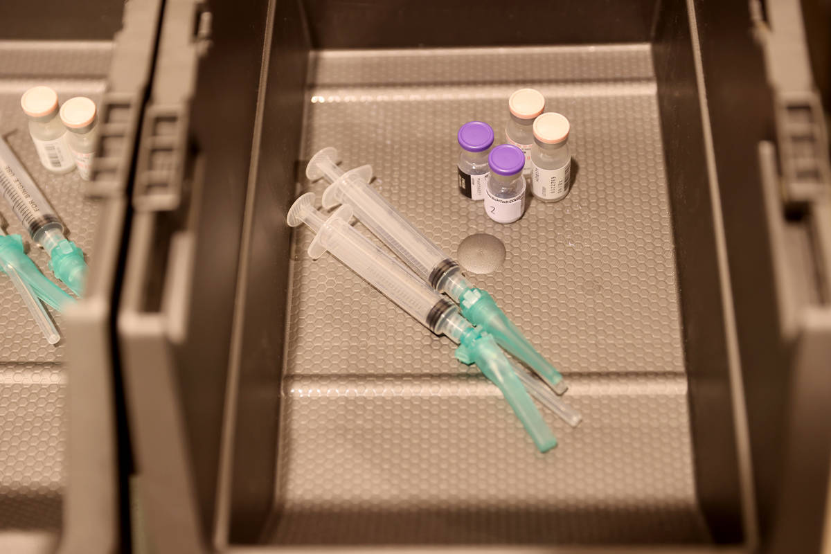 Pfizer vaccine, diluent and syringes used for dilution in bins at the Cashman Center COVID-19 v ...