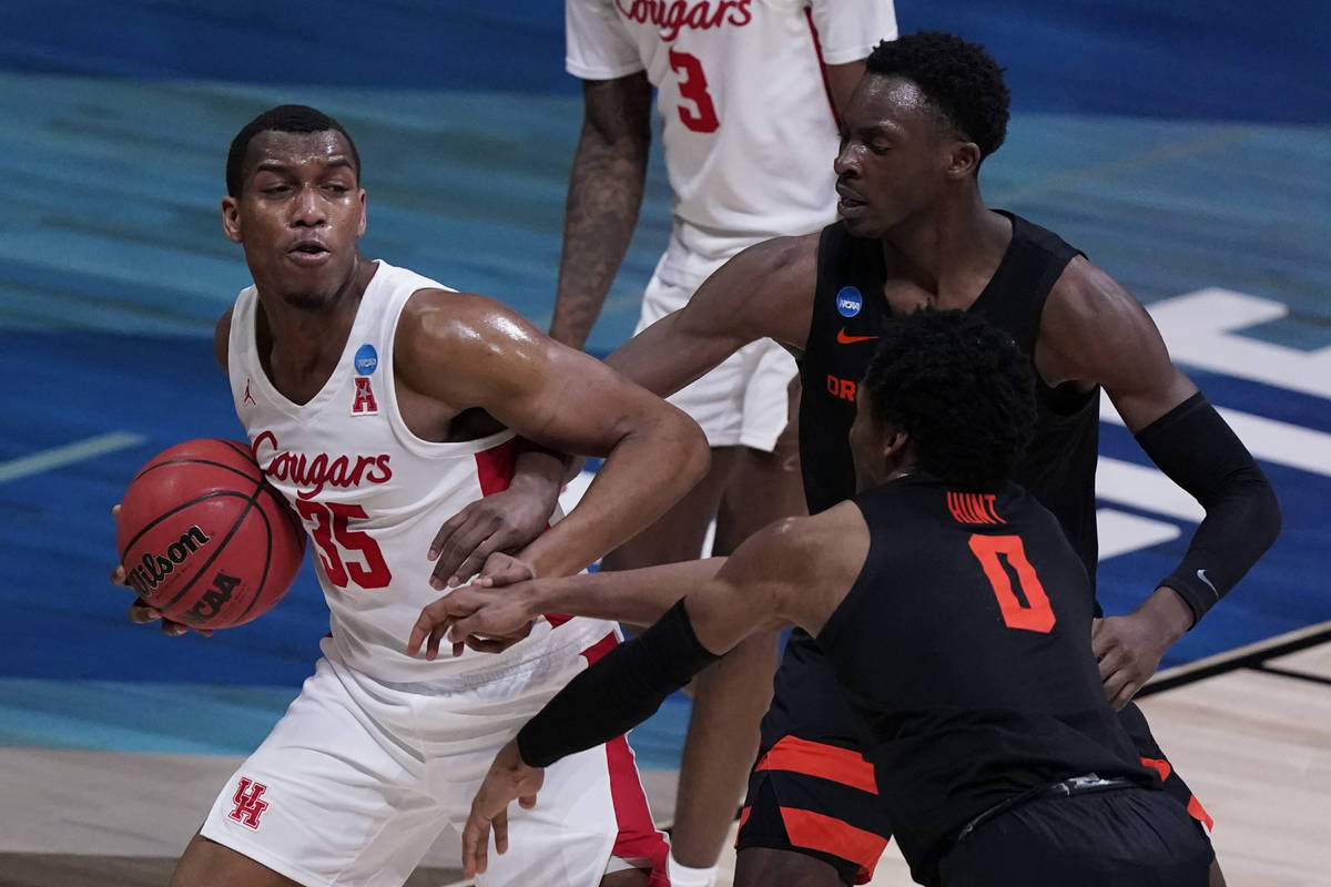 Houston forward Fabian White Jr. grabs a rebound in front of Oregon State forward Warith Alatis ...