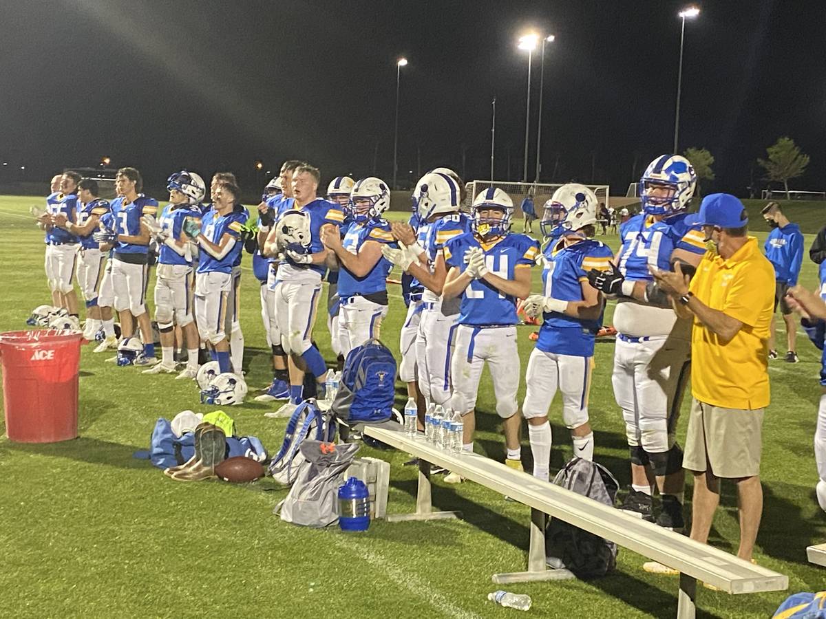 Moapa Valley players sing the school's fight song in celebration of an 18-14 win over rival Vir ...