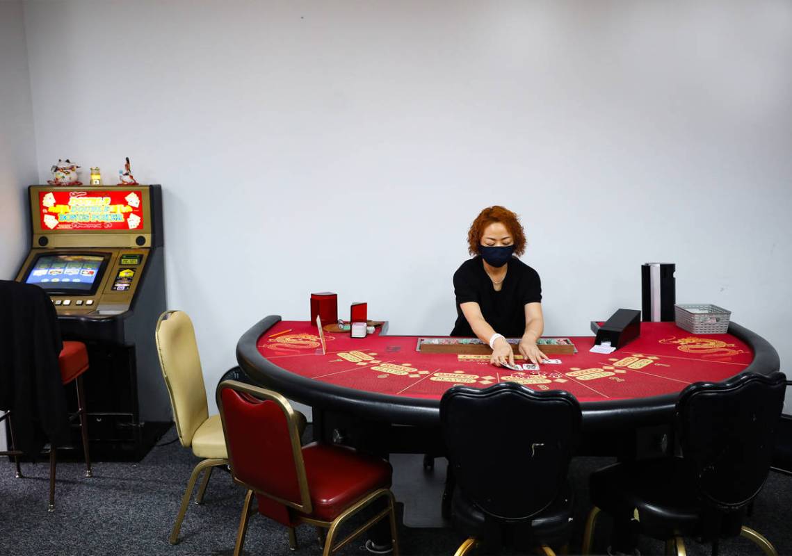 Soon Lee practice dealing for baccarat at the CEG Dealer School in Las Vegas, Thursday, April 1 ...