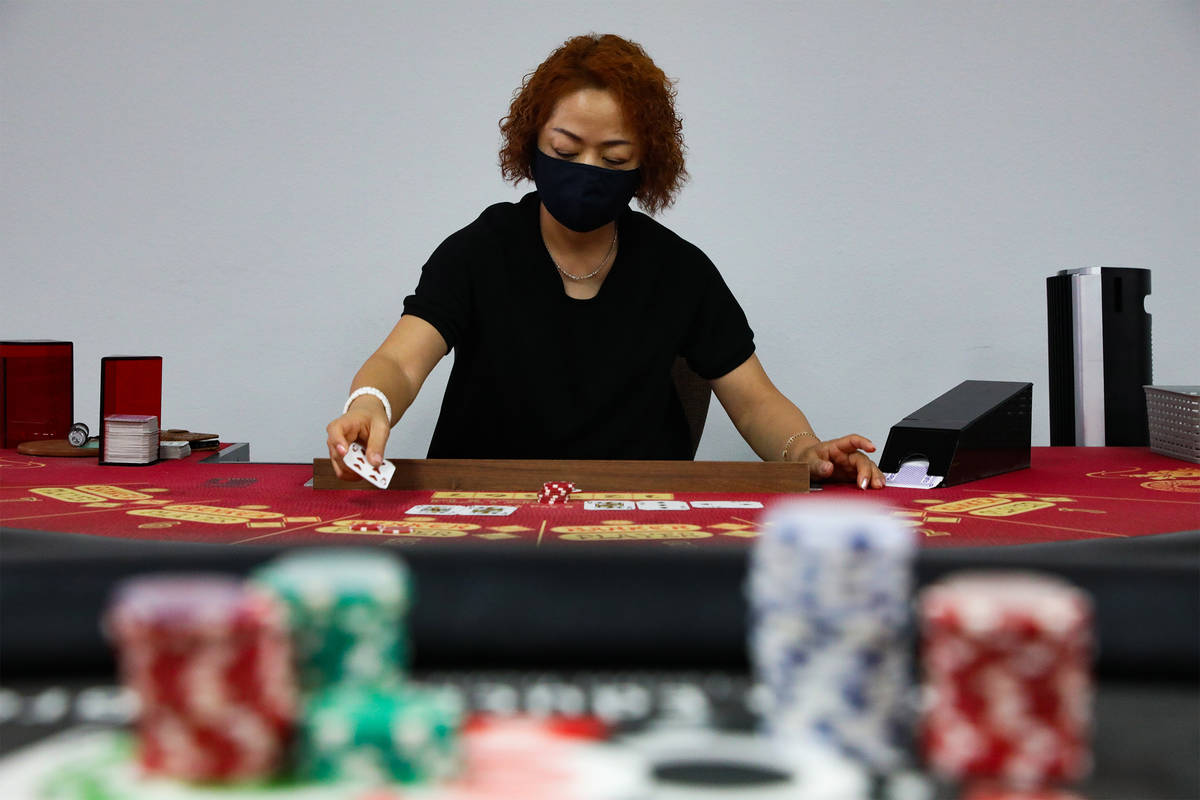 Soon Lee practice dealing for baccarat at the CEG Dealer School in Las Vegas, Thursday, April 1 ...