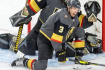 Golden Knights defenseman Brayden McNabb (3) takes a puck to the shin while defending the net w ...