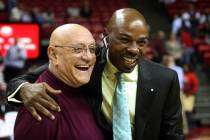 Former Las Vegas basketball coach Jerry Tarkanian, left, greets former player Greg Anthony, rig ...