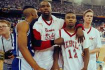 In this March 30, 1991, file photo, UNLV's Anderson Hunt (12) and unidentified teammates leave ...