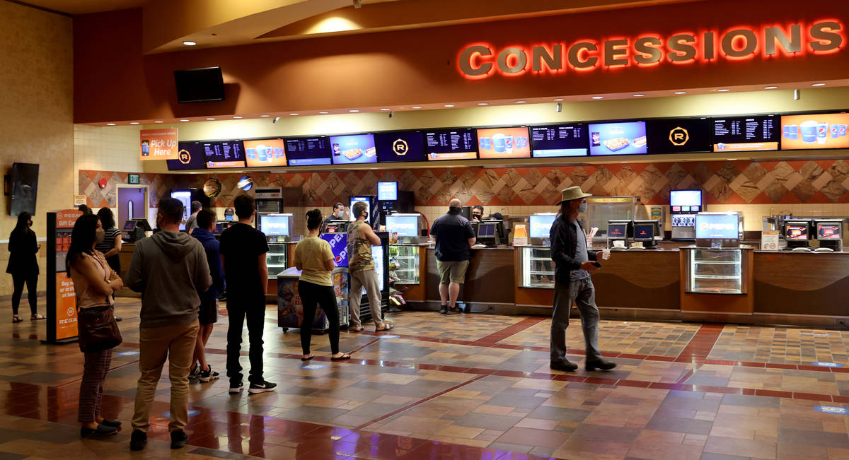 People buy tickets and concessions at Regal theaters at Red Rock Resort in Las Vegas on reopeni ...