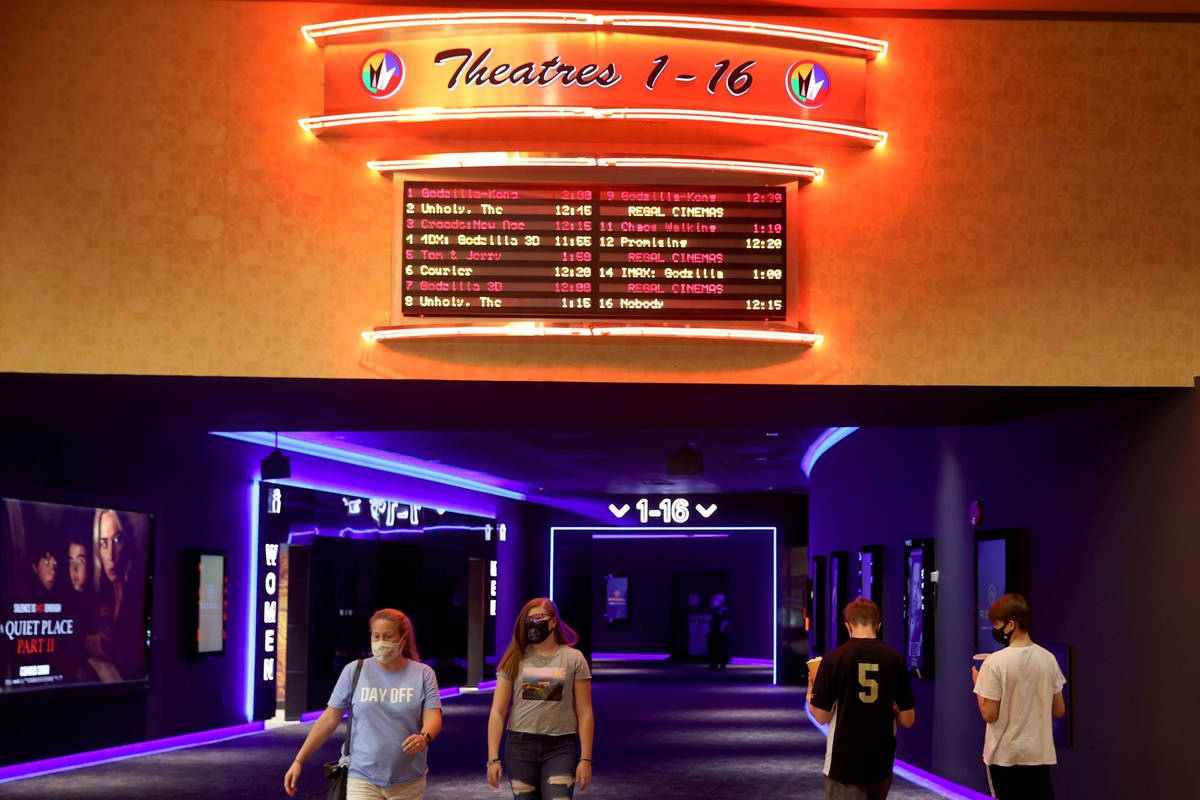 People head to theaters at Regal at Red Rock Resort in Las Vegas on reopening day Friday, April ...