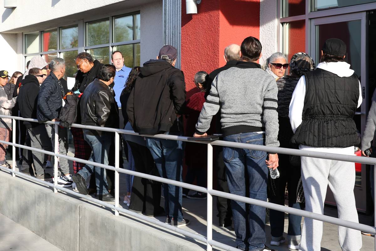 People wait in line at One-Stop Career Center on March 16, 2020, in Las Vegas. (Bizuayehu Tesfa ...