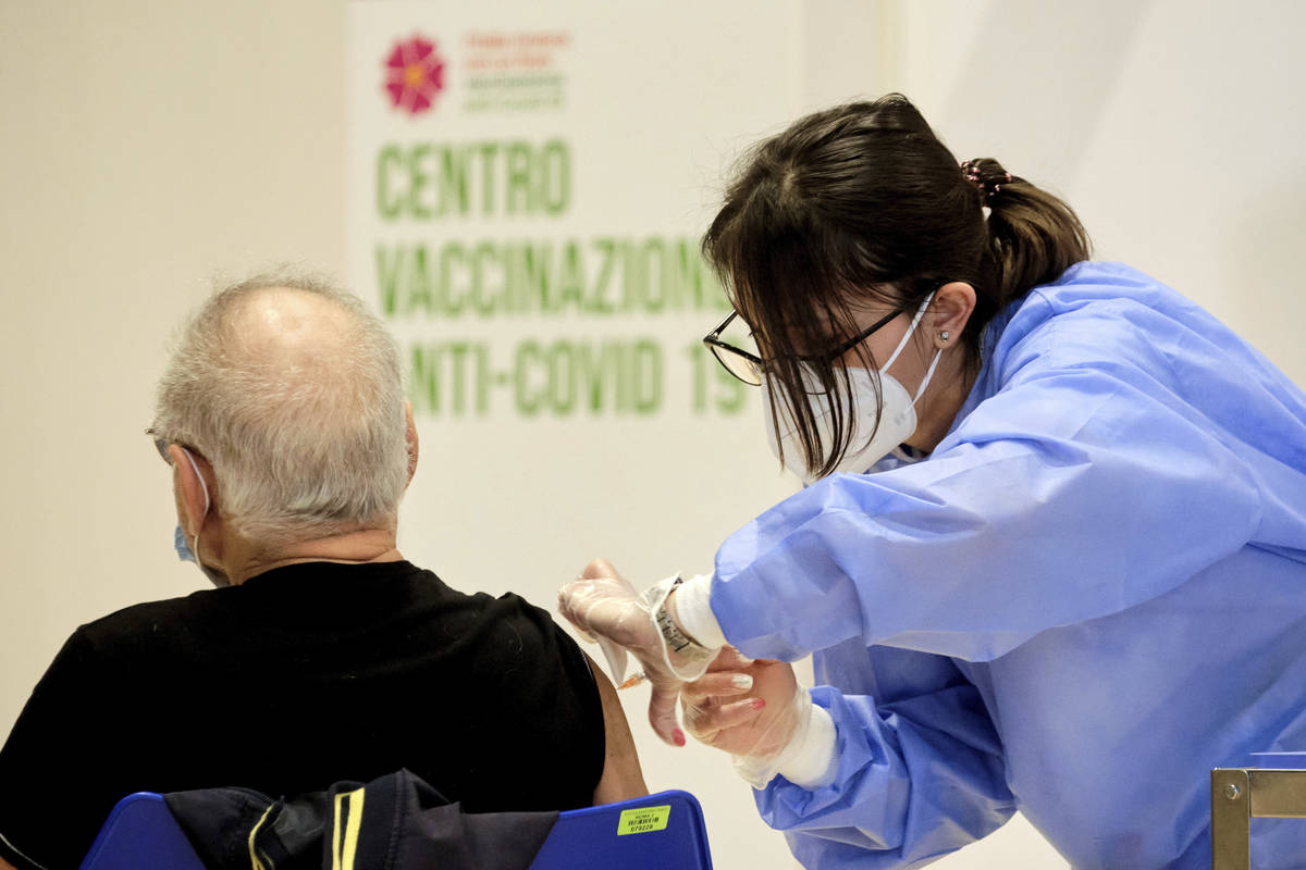 A person receives his shot of vaccine against Covid-19 as the vaccination campaign continues on ...