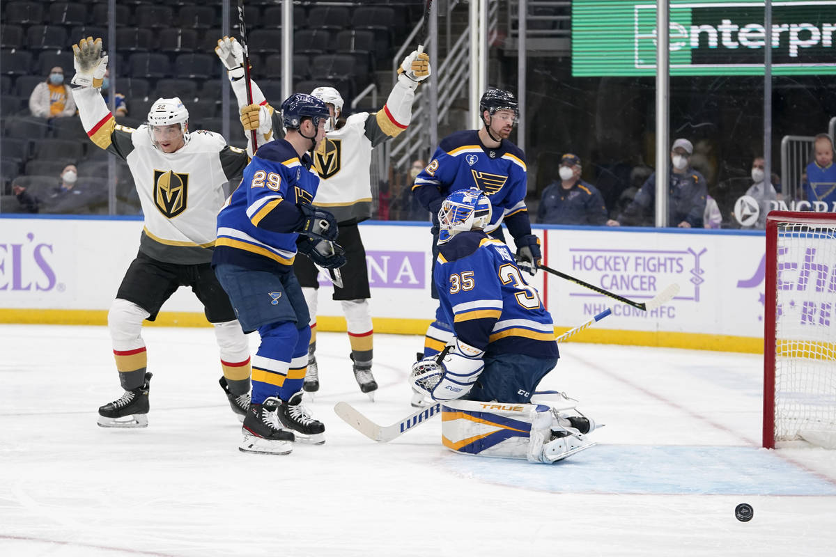 Vegas Golden Knights' Tomas Nosek, left, celebrates after scoring past St. Louis Blues goaltend ...