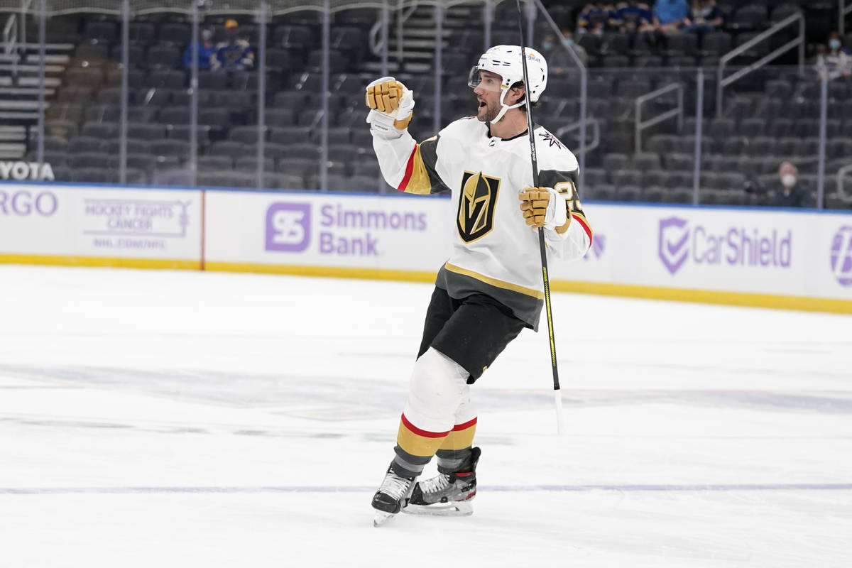 Vegas Golden Knights' Alec Martinez (23) celebrates after scoring during the first period of an ...