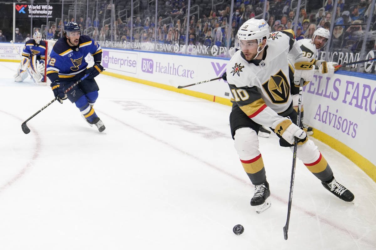 Vegas Golden Knights' Nicolas Roy (10) looks to pass as St. Louis Blues' Justin Faulk (72) defe ...