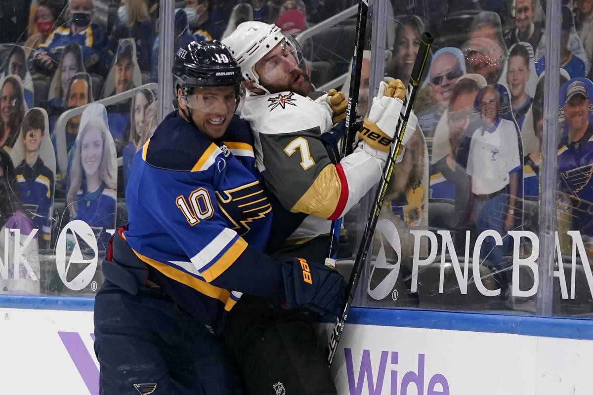 St. Louis Blues' Brayden Schenn (10) checks Vegas Golden Knights' Alex Pietrangelo into the boa ...