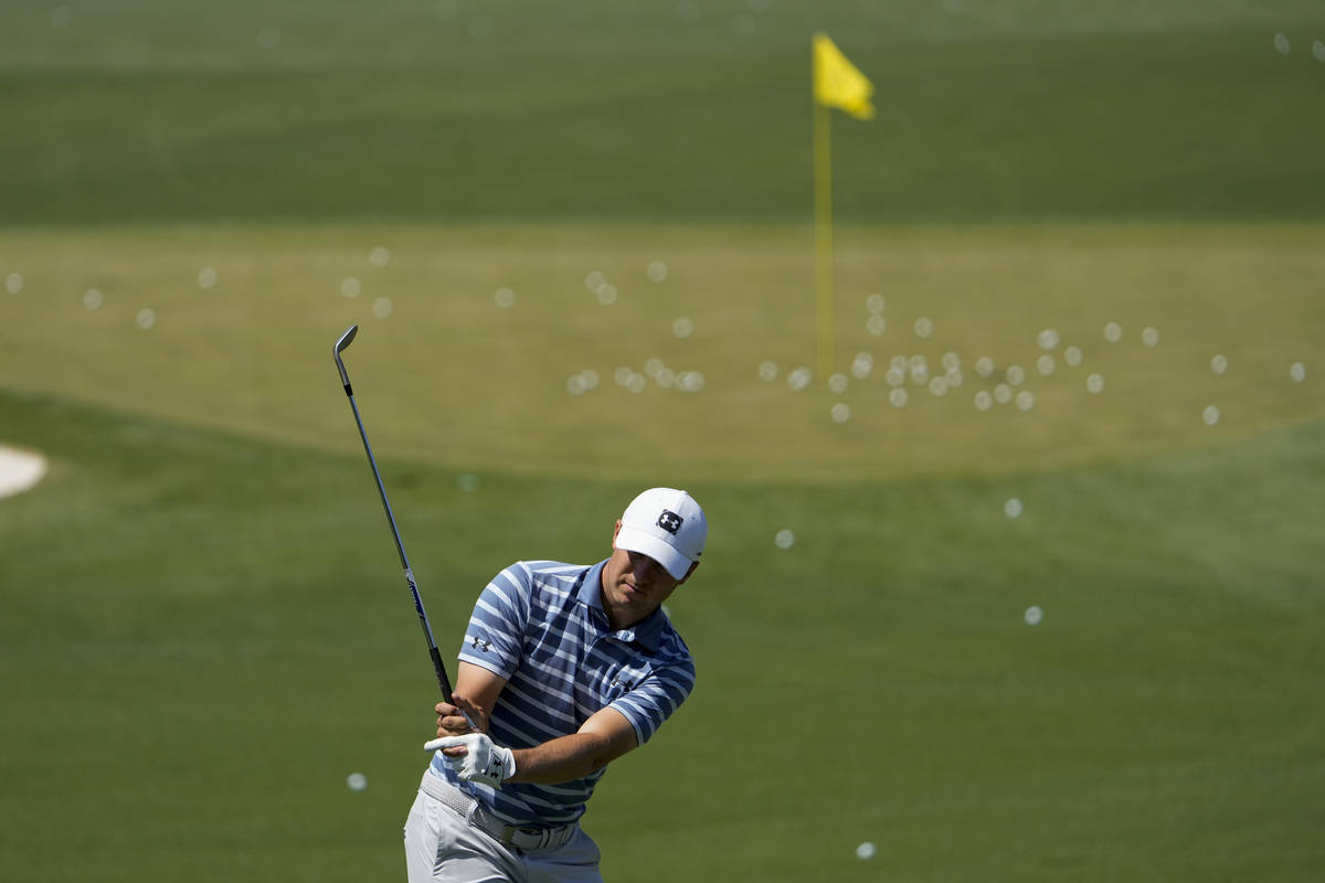 Jordan Spieth works on the range during a practice day for the Masters golf tournament on Monda ...