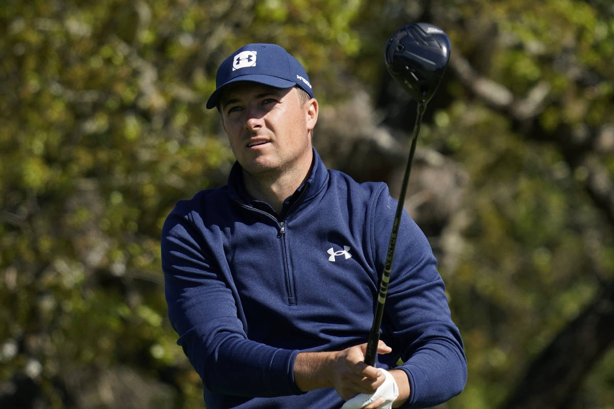 Jordan Spieth watches his drive from the second tee during the first round of the Texas Open go ...