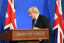 Britain's Prime Minister Boris Johnson leaves, after a coronavirus briefing in Downing Street, ...