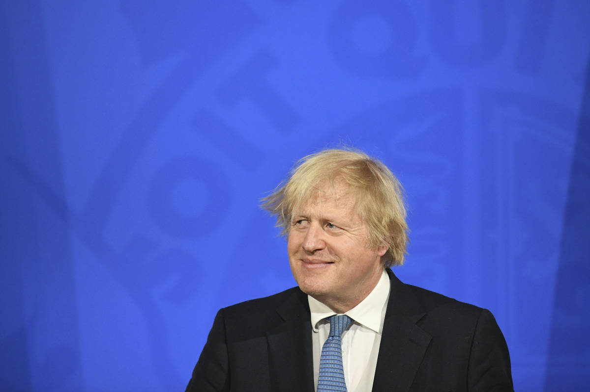 Britain's Prime Minister Boris Johnson pauses, during a coronavirus briefing in Downing Street, ...