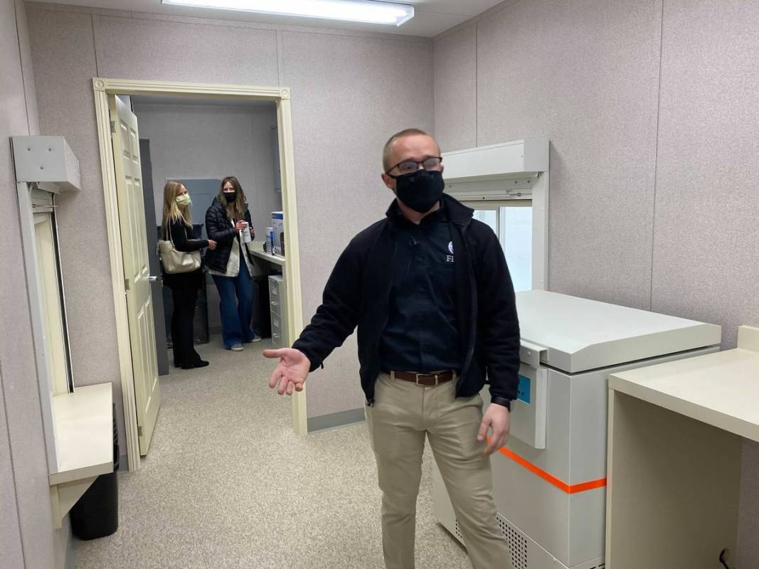 Maxwell Domalavage of the Federal Emergency Management Agency stands inside one of the mobile v ...