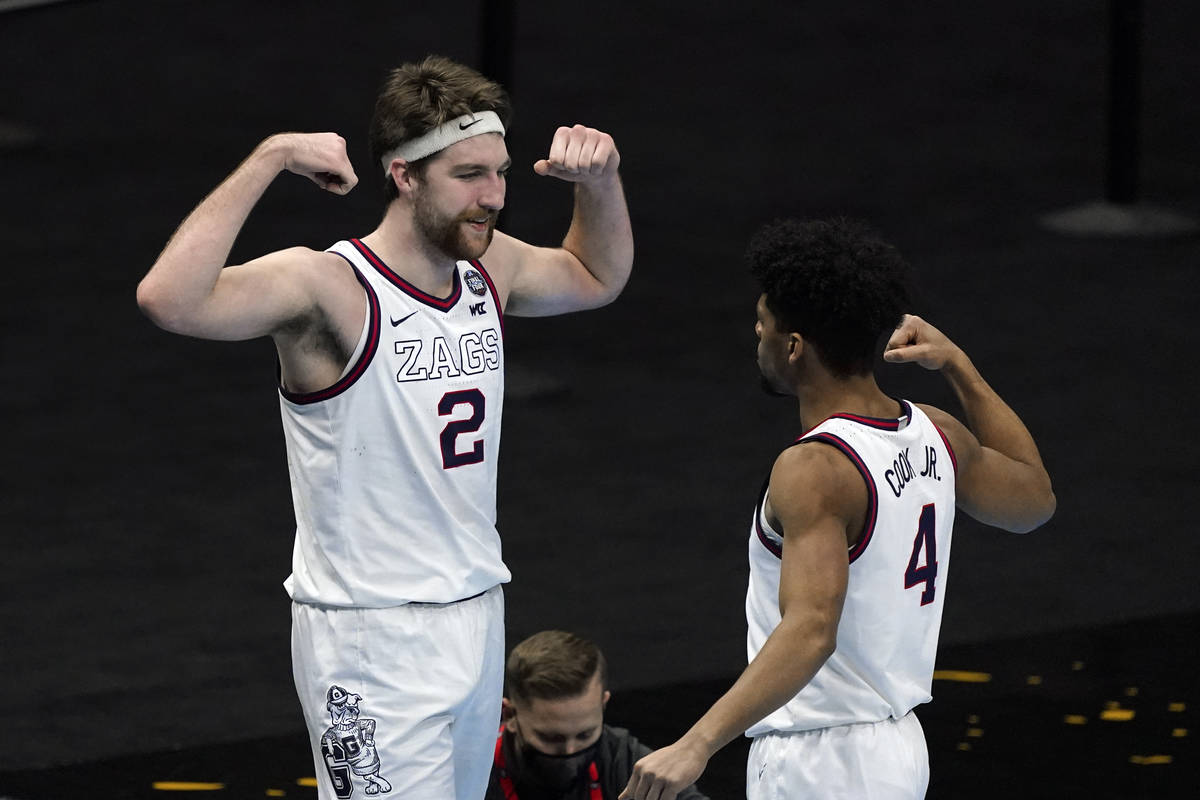 Gonzaga forward Drew Timme (2) celebrates with teammate guard Aaron Cook (4) after making a bas ...