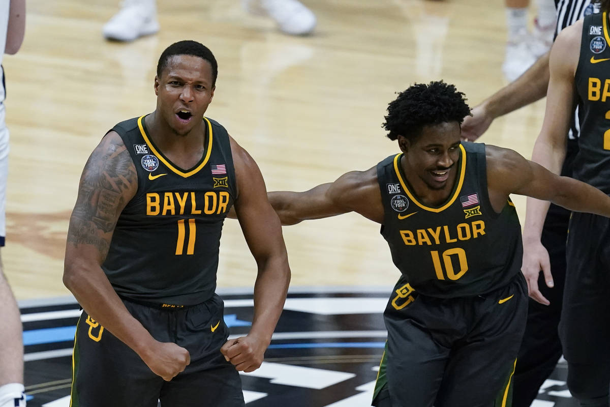 Baylor guard Mark Vital (11) celebrates with teammate guard Adam Flagler (10) during a timeout ...