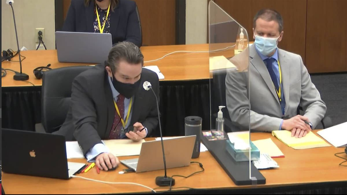 In this image from video, defense attorney Eric Nelson, left, and defendant, former Minneapolis ...
