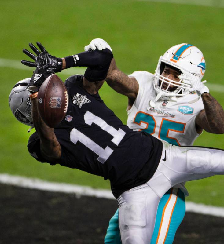Raiders wide receiver Henry Ruggs III (11) is unable to catch the ball as Miami Dolphins corner ...