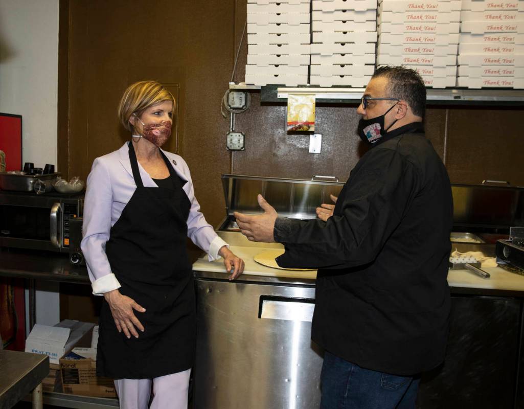 Rep. Susie Lee listens to Vincenzo Cimino, owner of Vinny's Pizzeria, as she visited the restau ...