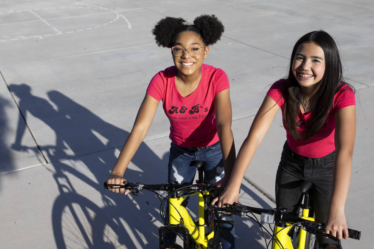 Bella Hawkins, 15, and Aiyana Castro, 12, at Radiant Ruby Park on Friday, April 9, 2021, in Las ...