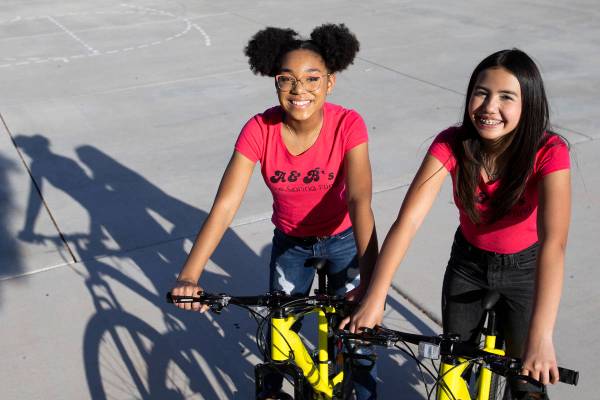 Bella Hawkins, 15, and Aiyana Castro, 12, at Radiant Ruby Park on Friday, April 9, 2021, in Las ...
