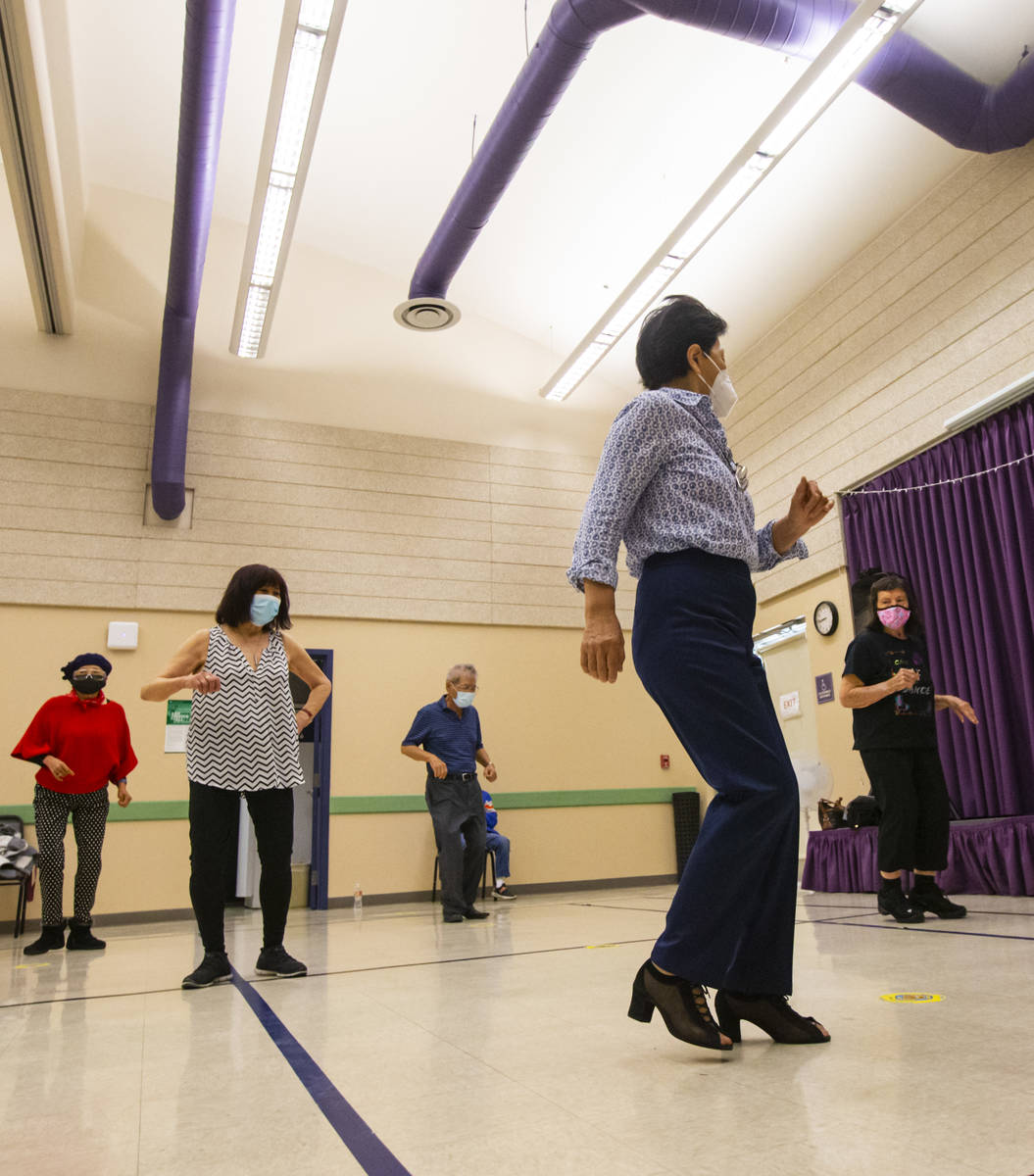 May San Carment, 73, right, participates during a line dancing class at the West Flamingo Senio ...
